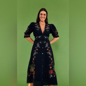 Beautiful dress. Buttons all work. Never worn and is in new condition.